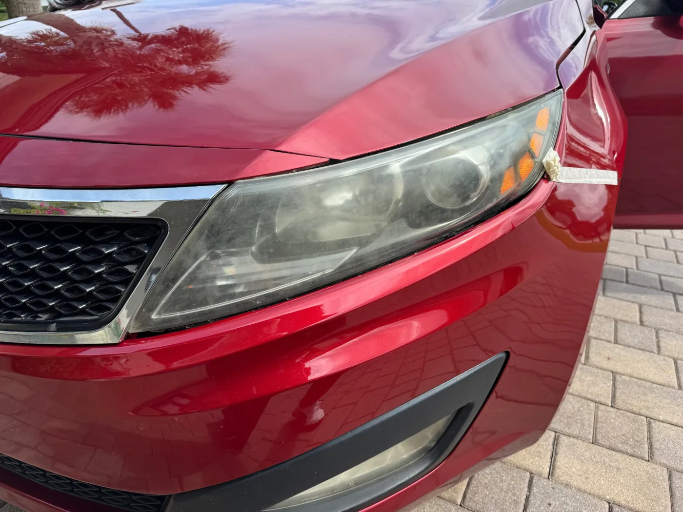 Headlight restoration before — 2013 Kia Optima, Boca Raton